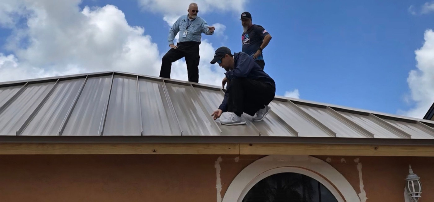 Kaizen Roofing team inspecting a finished roof installation